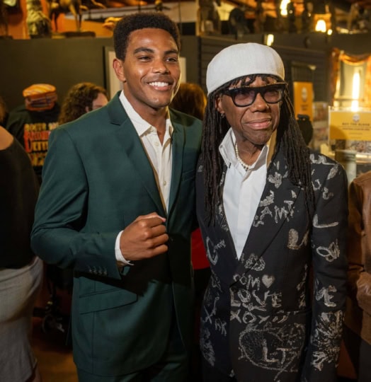 Jaalen Best and Nile rodgers pose together, Best holds up a fist